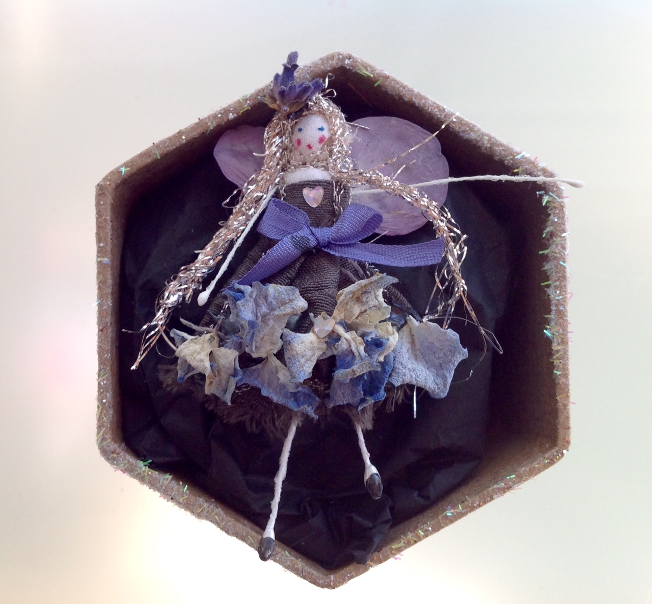 A 6 cm boxed fairy with her name in the lid. Dressed in dried hydrangea and lavender. £12 plus £3.50 p&p.