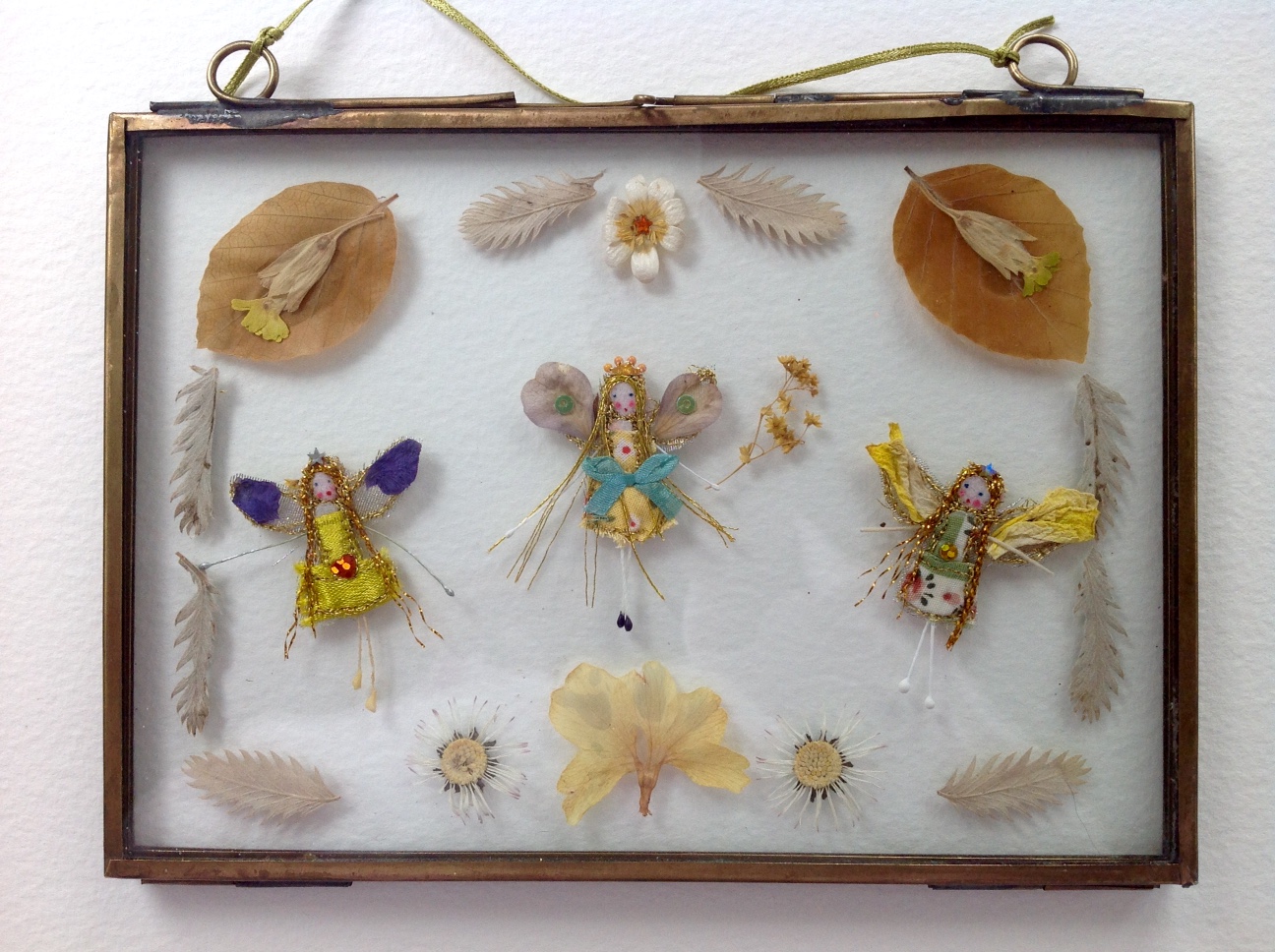 17.5x12.5 cm brass framed fairies. with dried cowslips, daisies and beech leaves. £35 plus £3 p&p.