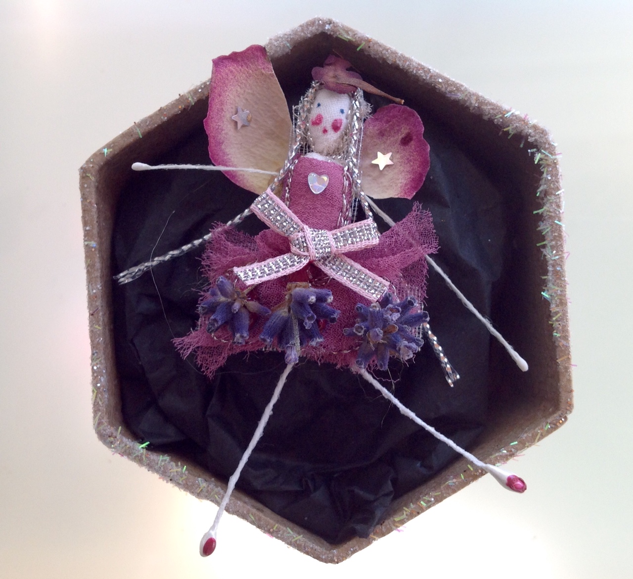 A 6 cm boxed fairy with her name in the lid. Dressed in dried rose and lavender. £12 plus £3.50 p&p.