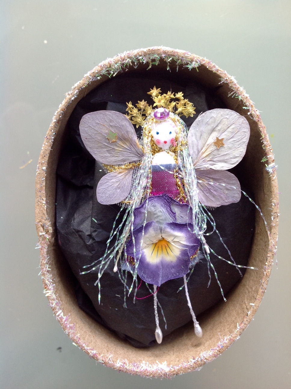 A 6 cm fairy in a box with her name the lid. Dressed in hydrangea and pansy flowers. £12 plus £3.50 p&p