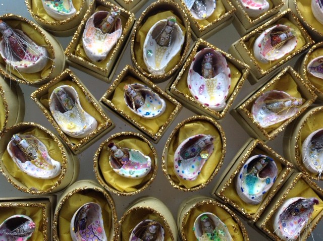 5cm( box size) embroidered mermaids with tiny sequins and jewels tucked inside a painted slipper shell. Each mermaid has her secret name in the lid. £12 plus £2 p&p