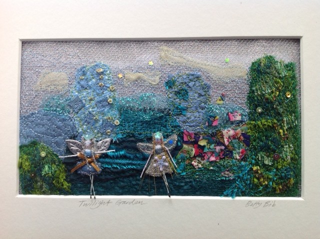 A 17x9.5cm machine and hand embroidery.