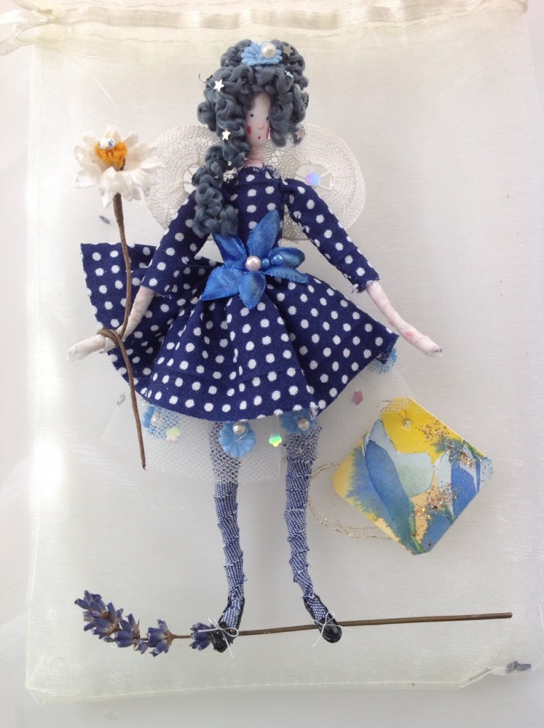 DOTTY; A 14cm high fairy with a painted silk head. She is wearing a cotton dress with a net petticoat and has lace wings. She comes with a hand painted name tag and in an organza bag with dried petals. £25 plus £2 p&p