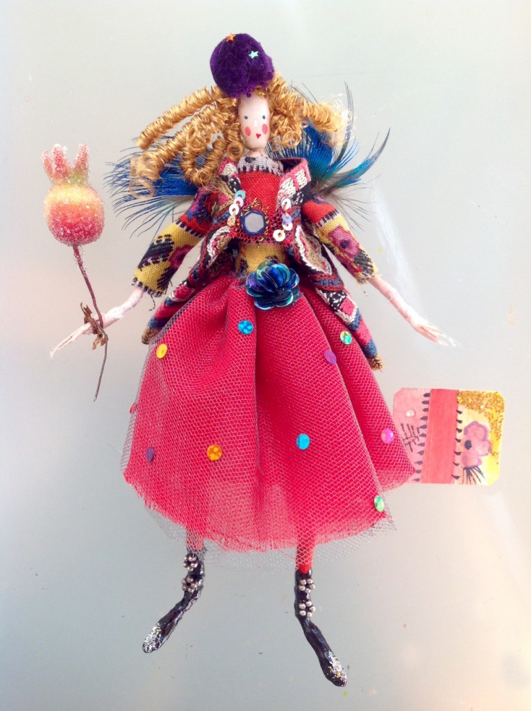DORA A 16cm high fairy wearing a chiffon and net skirt , fine wool top and embroidered jacket with a mirror fastening. She is also wearing patent black boots with embellishments and glitter toes and a pop pom hat and crystallised berry wand. Her wings are pheasant feathers and she comes with a hand- painted name tag and in an organza bag with dried flowers. £40 plus £3.50 p&p