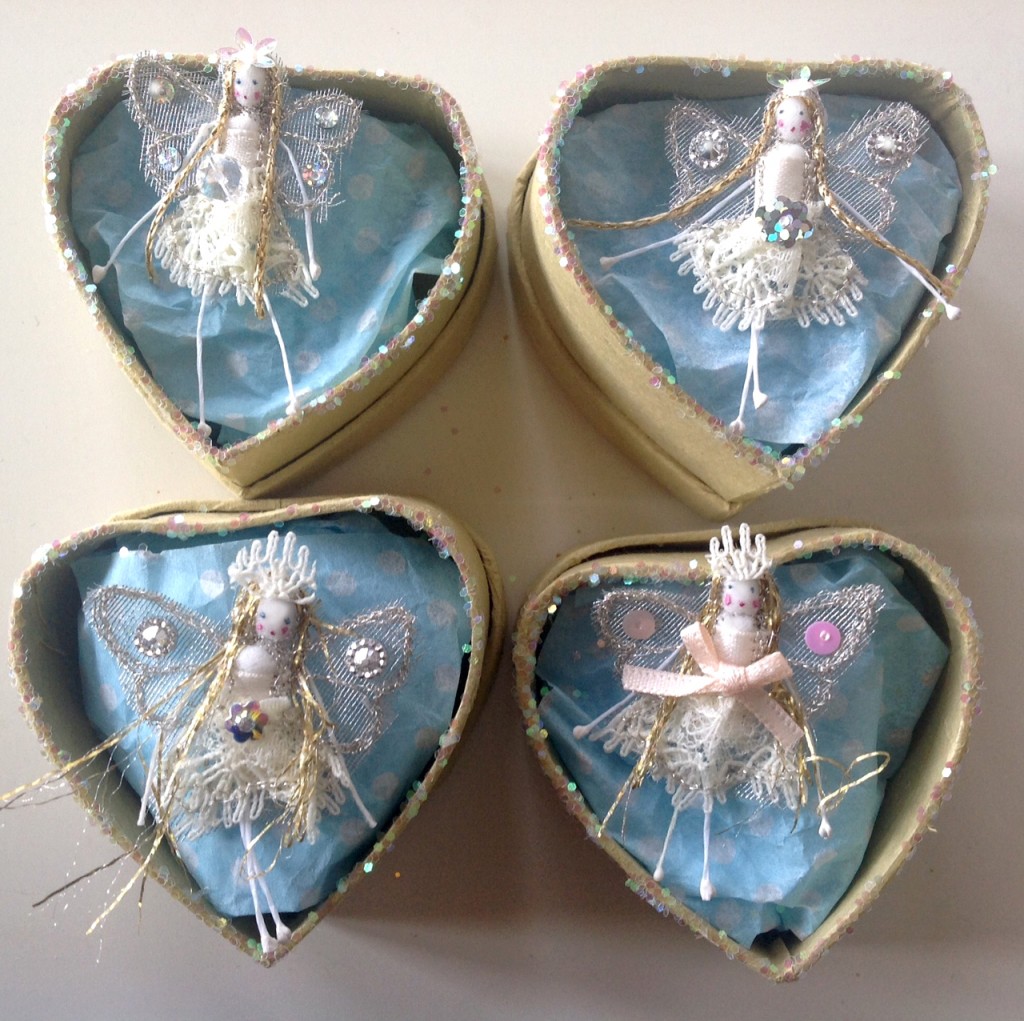 5cm boxed snowflake fairies . made with organza wings, lace and tulle dresses and decorated with sequins. Each fairy has fed secret name in the lid of the box. £8 plus £3.50 p&p ( only one charge for multiple buys). Please e mail and specify which fairy you would like... I have more on request.