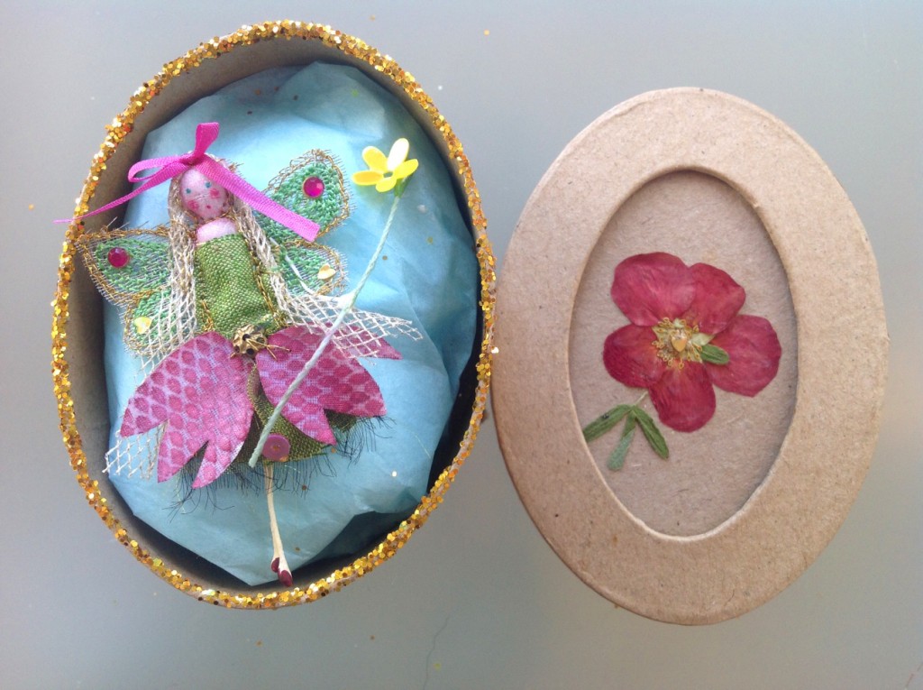 An 8cm oval boxed fairy with a hand painted snakeskin fritillary dress, embellished with sequins and a fine silk ribbon. Her name is in the lid of the box which has a pressed flower on it's top. £11.50 plus £3.50 P&P.