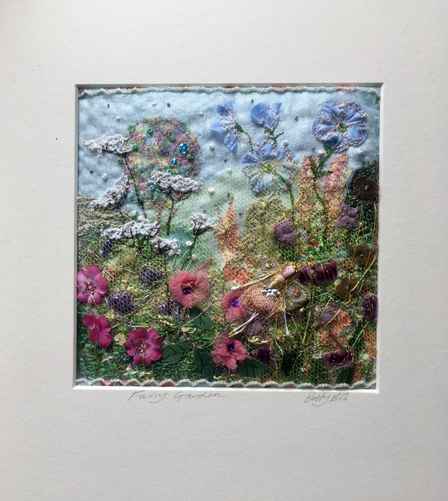 A 14 square cm machine and hand embroidery in a 24 cm square mount. Worked on organza with cotton, silk, satin , tulle and sequins. £42including UK postage ( add £5 international postage). 